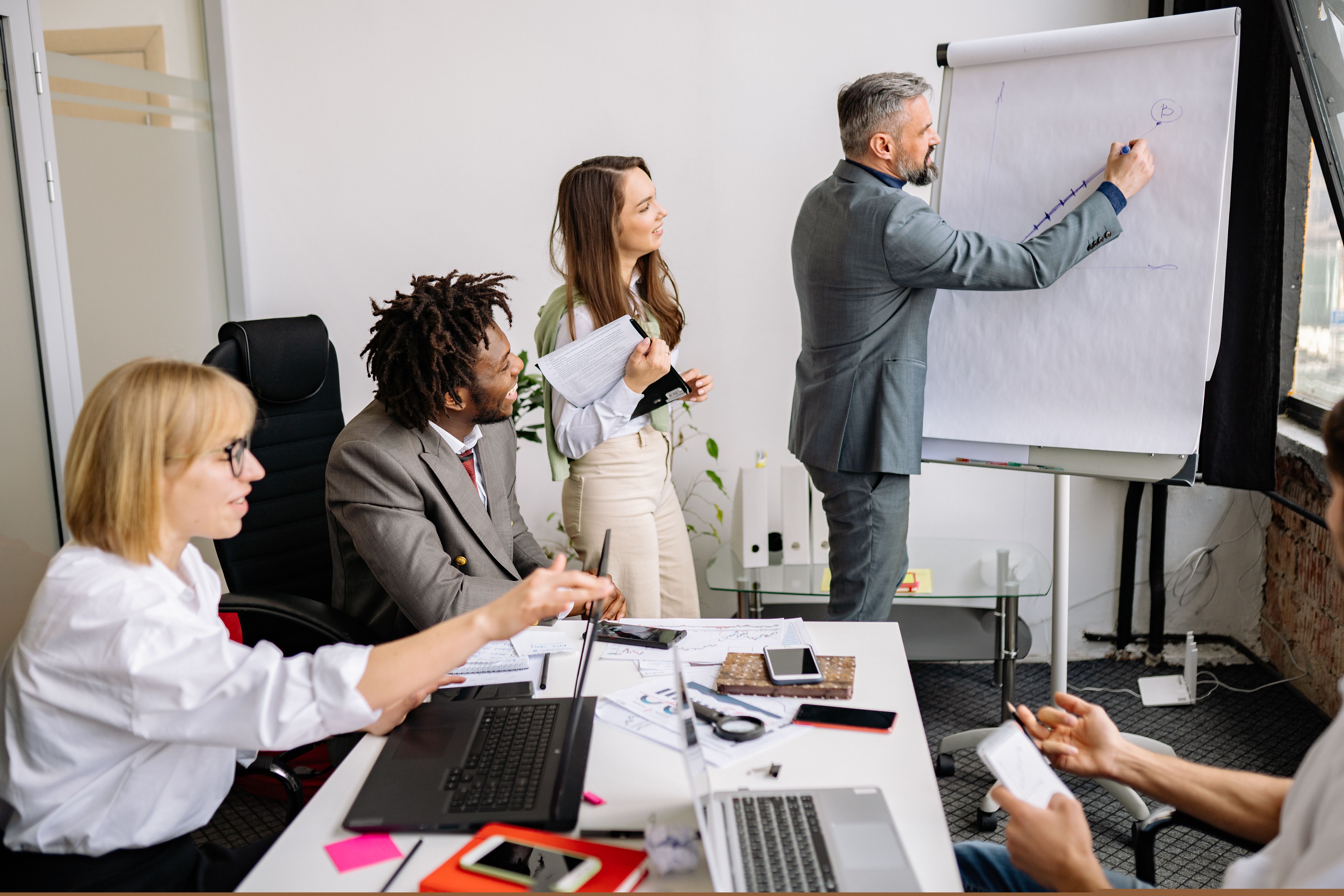 Team presenting project plans in a meeting